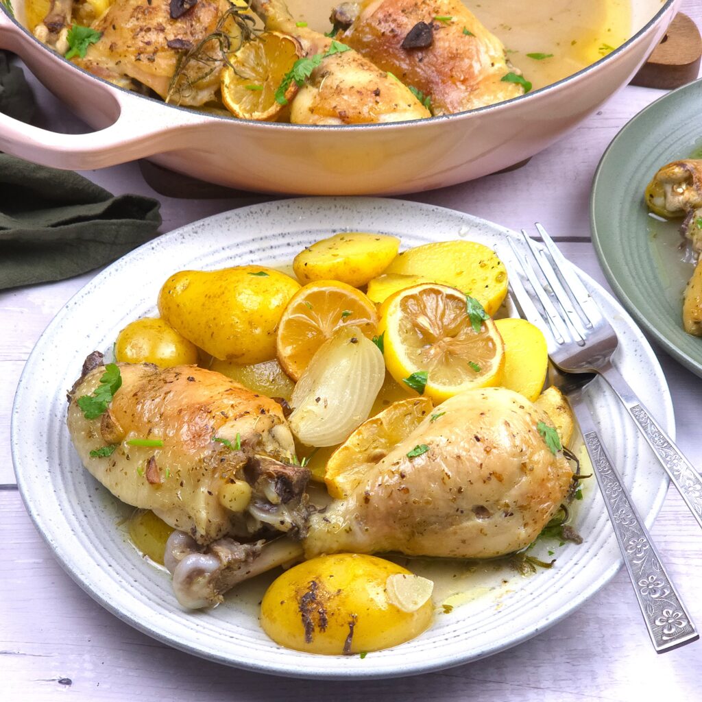 a plate with lemony chicken with potatoes