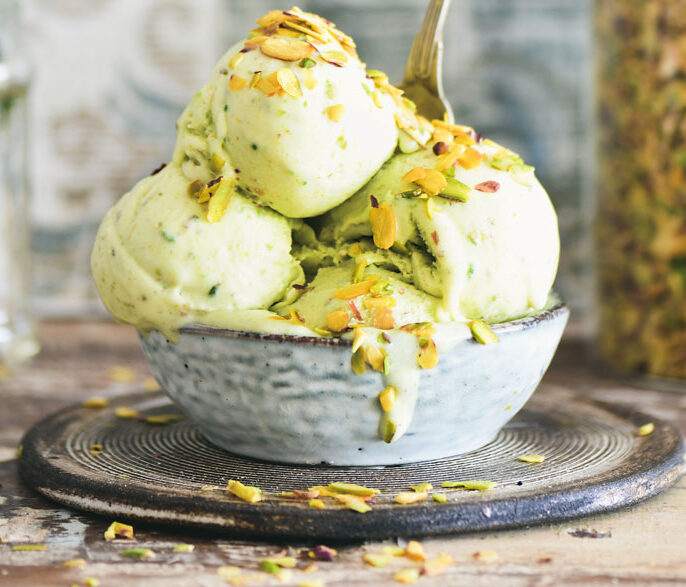 Homemade pistachio ice cream in a bowl, topped with crushed pistachios – gluten-free, dairy-free, and naturally sweetened.