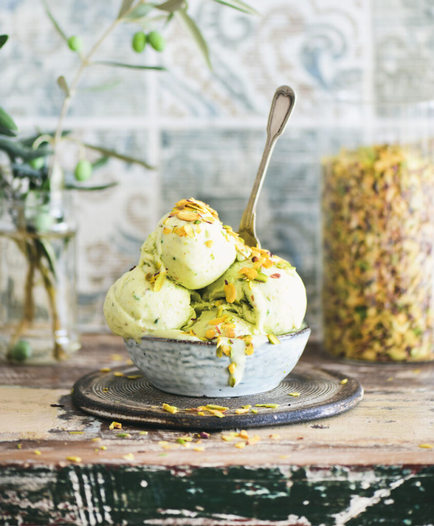 Homemade pistachio ice cream in a bowl, topped with crushed pistachios – gluten-free, dairy-free, and naturally sweetened.