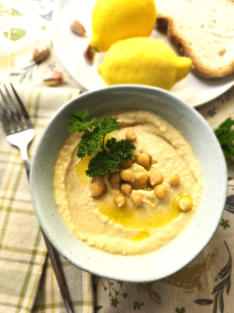the best homemade hummus recipe with a creamy, fluffy texture. Made with chickpeas, tahini, and lemon, it's a quick, nutritious, and versatile dish ready in minutes!
