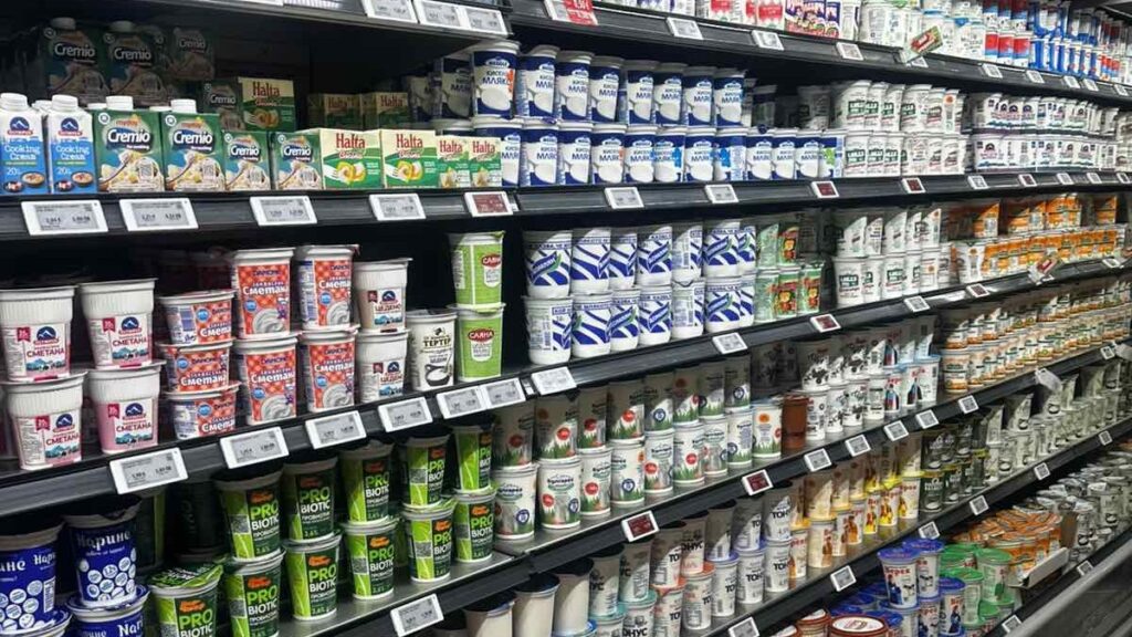 Bugarian yogurt in Bulgarian supermarket shelves as a part of the argument Greek yogurt vs Bulgarian yogurt