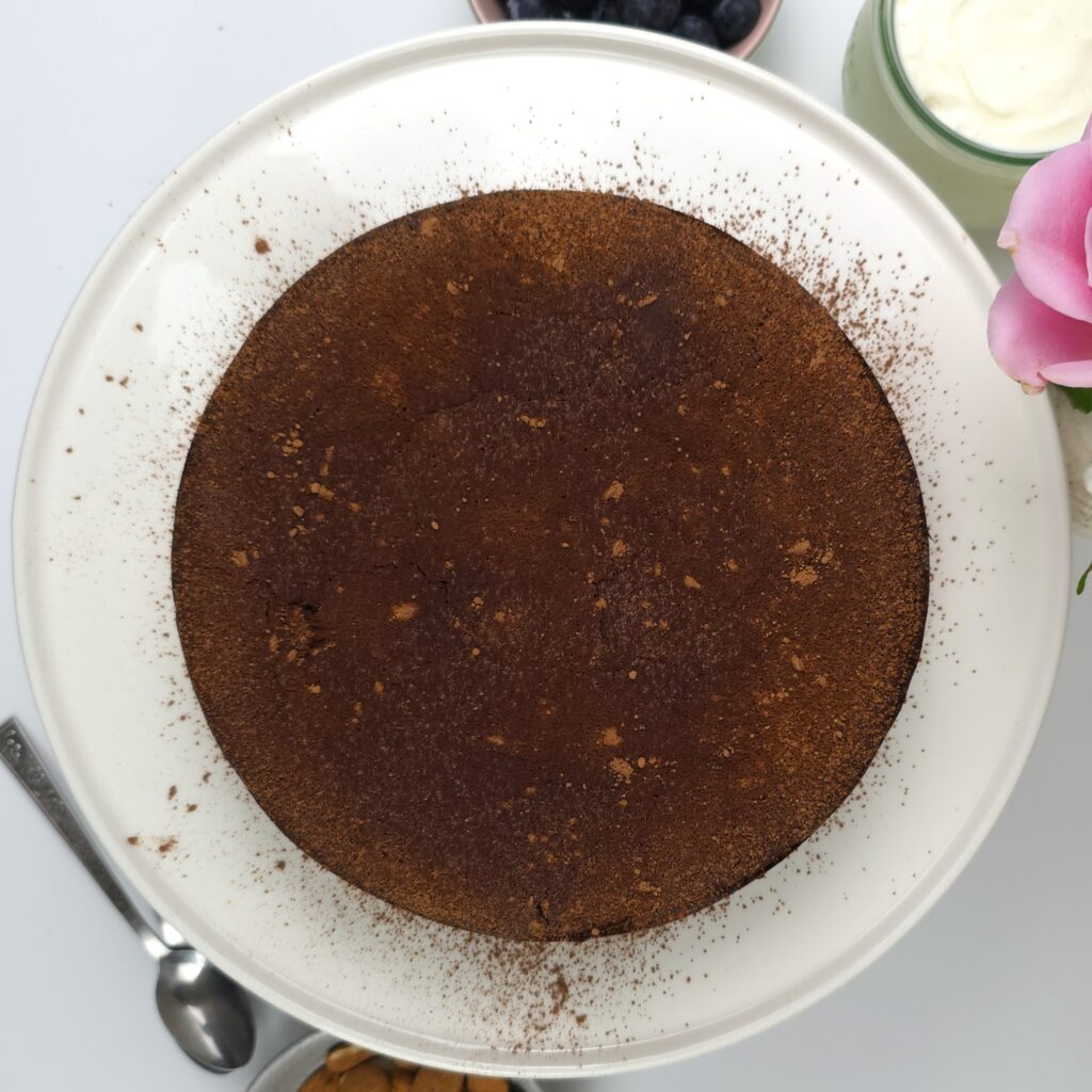 baked and placed on a cake stand torta caprese