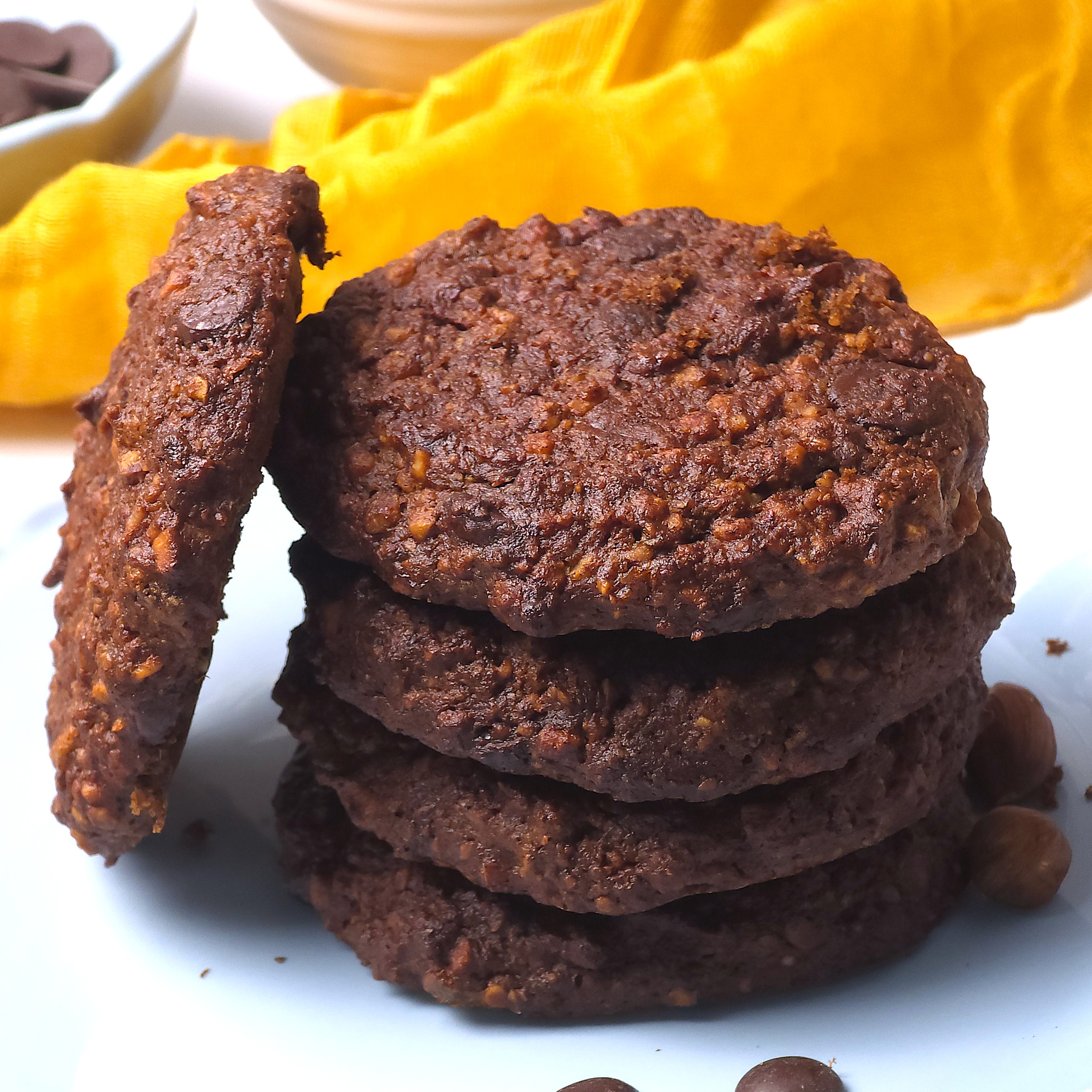 a close look to flourless hazelnut cookies in a blue plate
