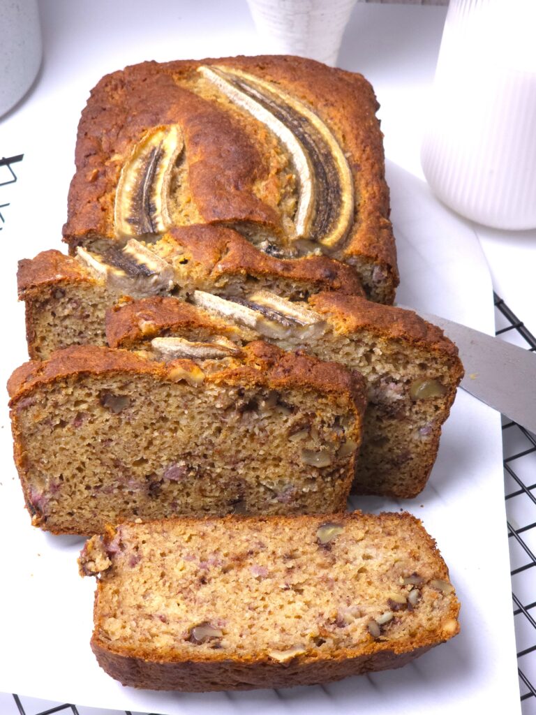 sliced gluten-free banana bread on a cooling rack
