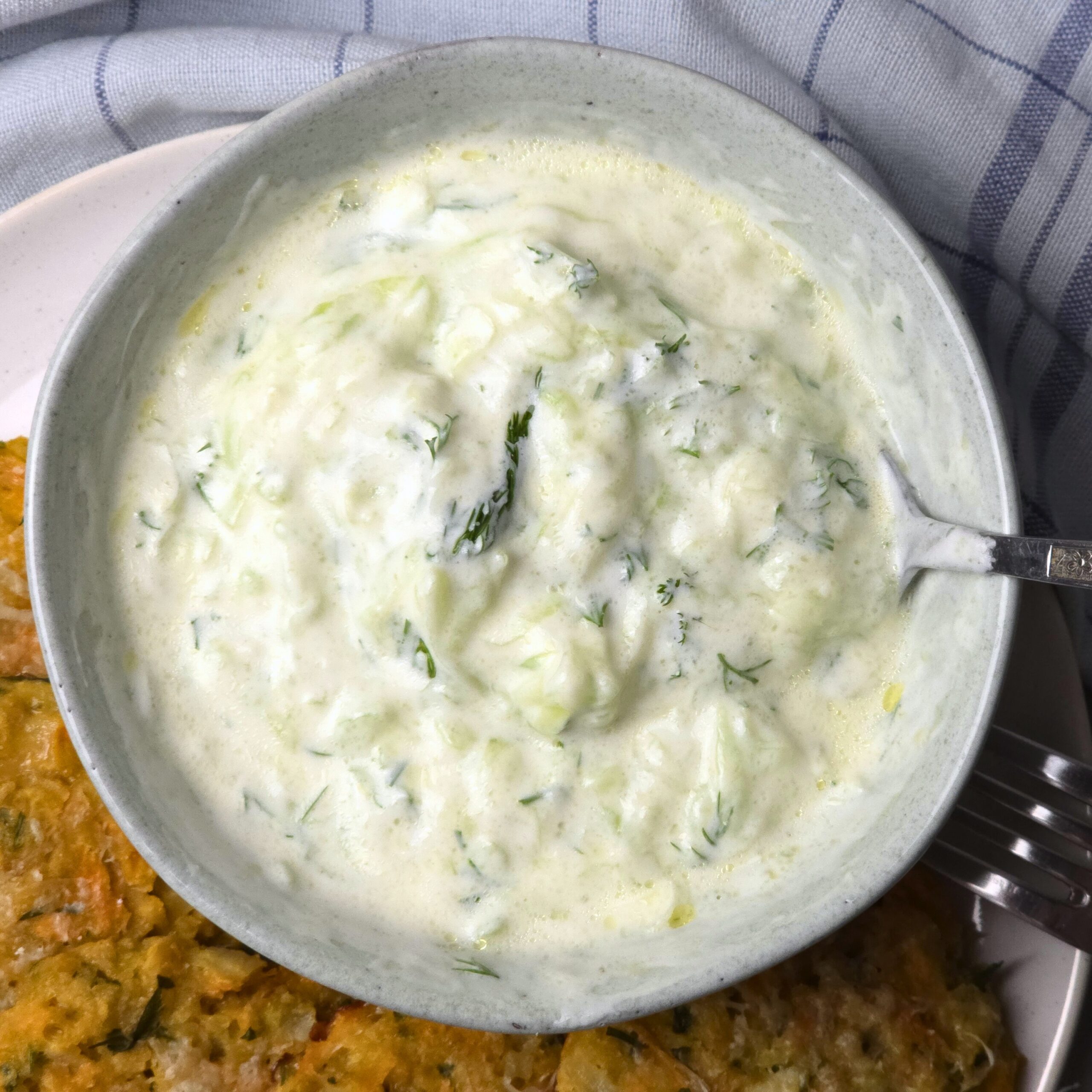 creamy tzatziki sauce in stoneware bowl