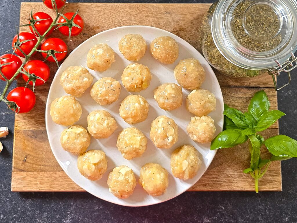 raw chicken meatballs in a plate