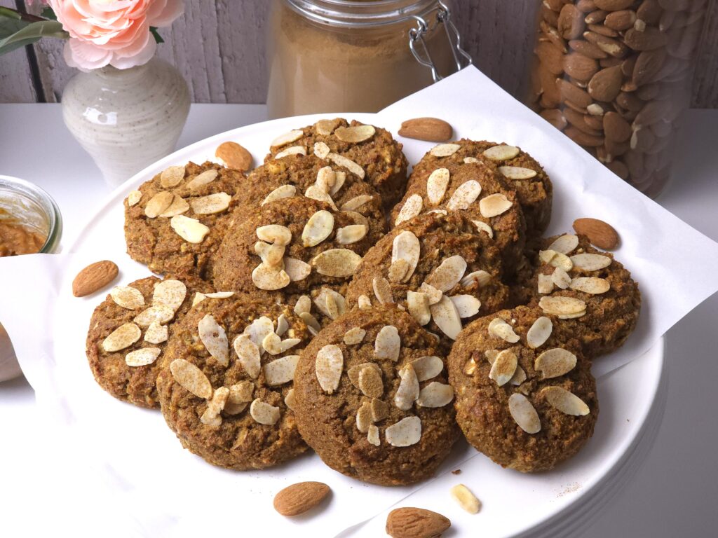 no sugar almond cookies on a white cake stand