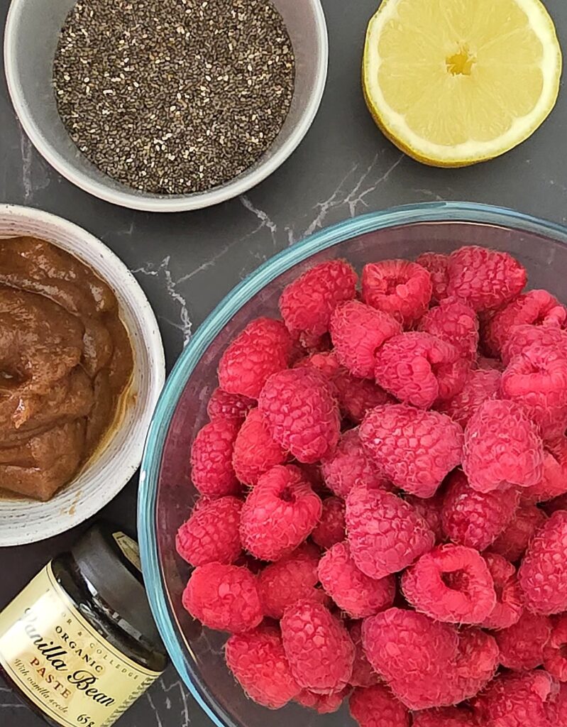 raspberry chia seeds jam ingredients in bowls