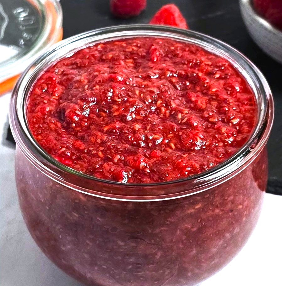a close look of raspberry chia jam in a jar