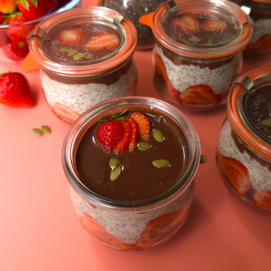 chilled jars with a strawberry chia seeds yoghurt dessert