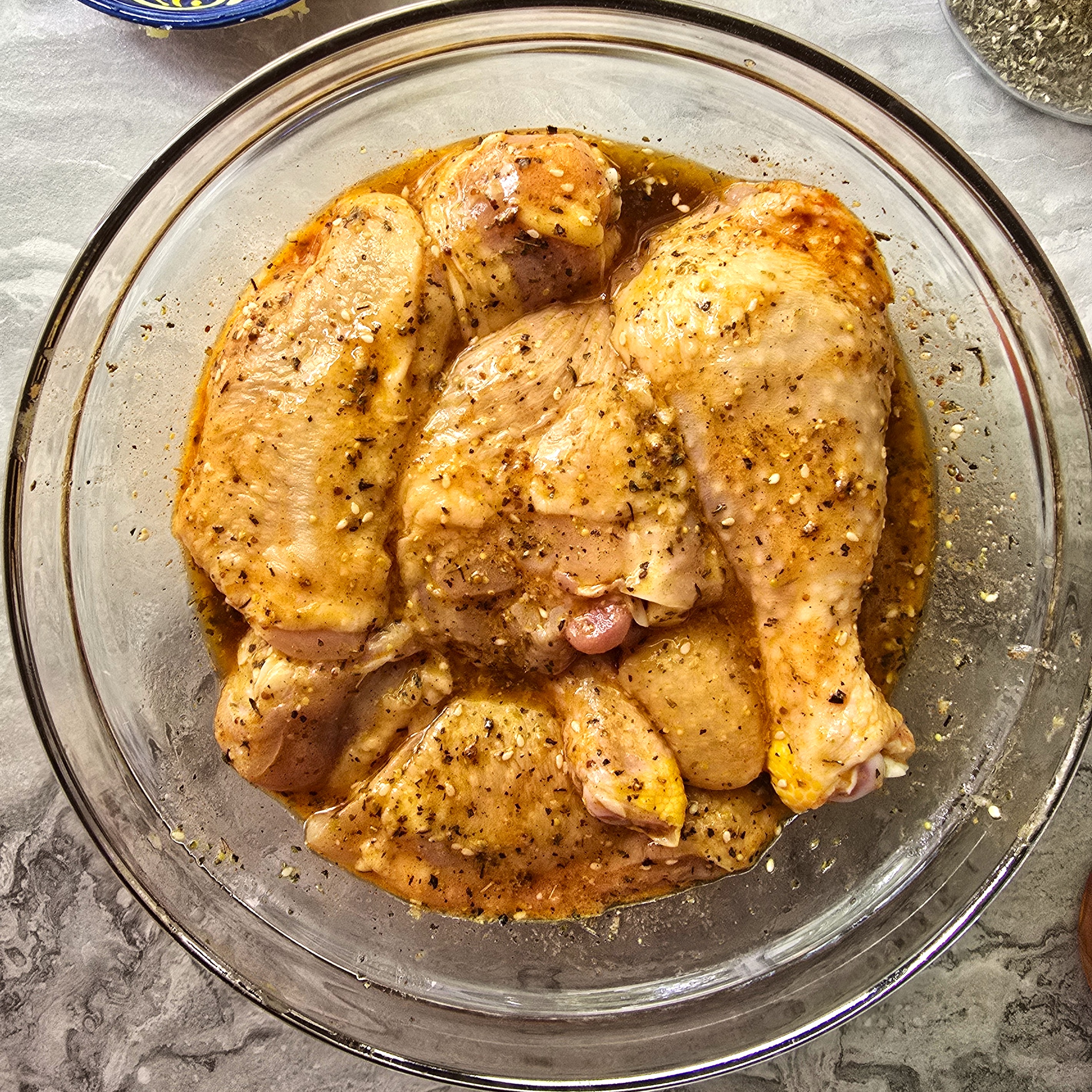 marinated chicken tights in a glass bowl