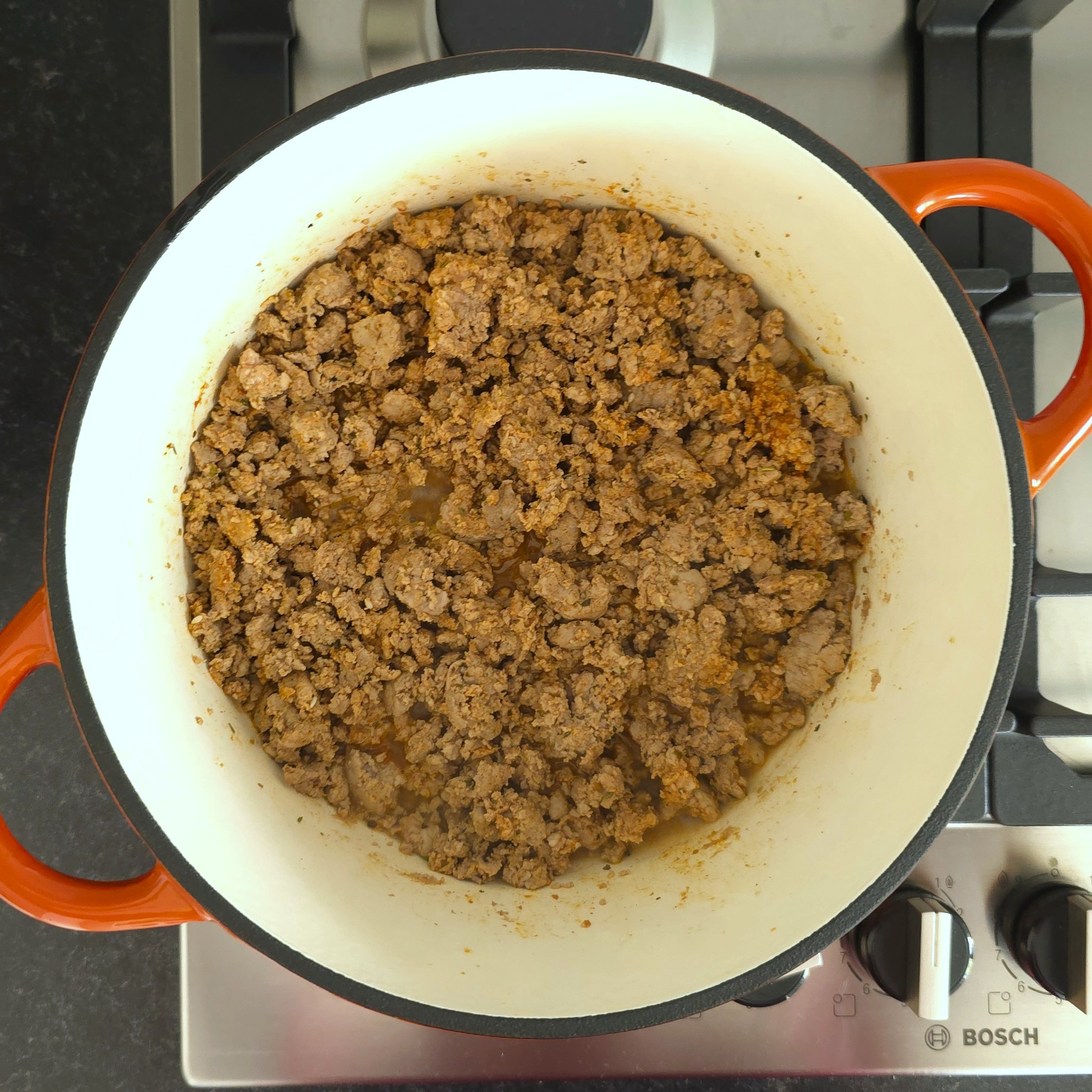 minced meat in a deep pot, sauteed in spices, oil and a splash of water