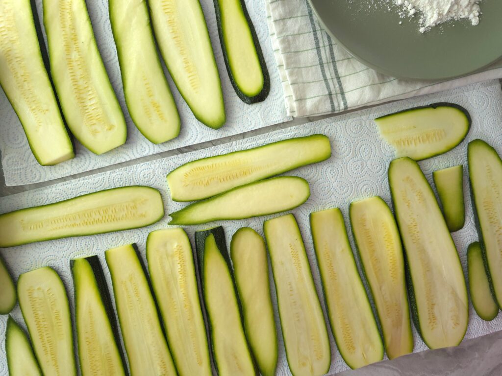 sliced courgettes on kitchen towel