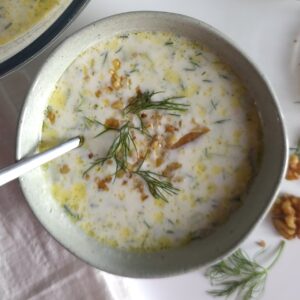 a stoneware bowl with Bulgarian tarator and spoon