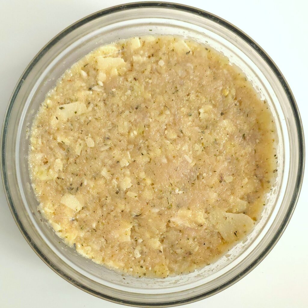 a bowl with mixed chicken meatballs ingredients