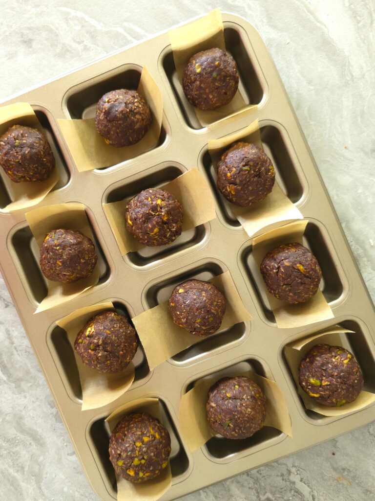 nut bars mixture, formed in balls ready for pressing in a square tin