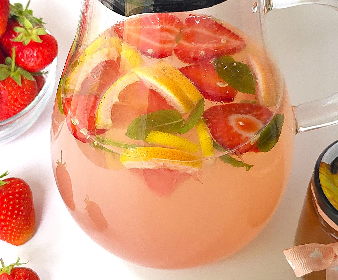 a close look of a jug with citrus mint electrolyte drink