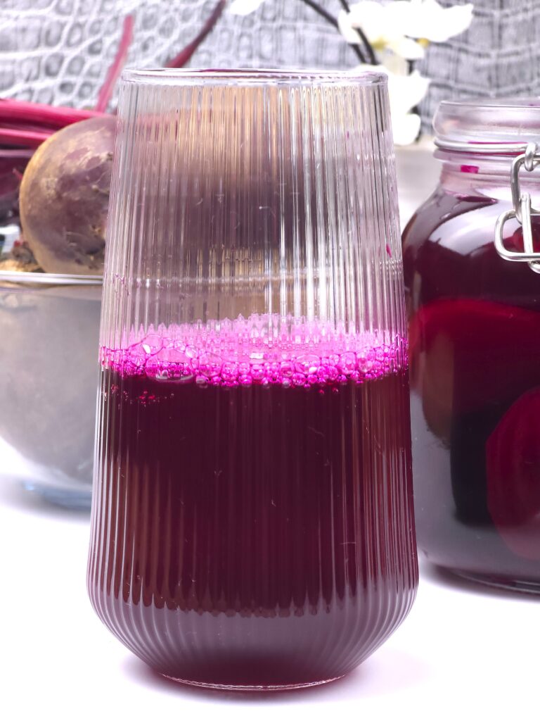 a close look of beetroot kvass in a glass