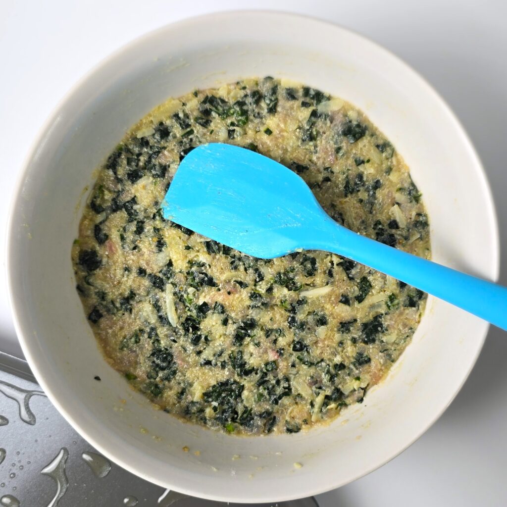 the mixture for turkey, kale, cheese patties in a mixing bowl