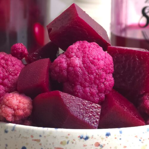 a close look of fermented beetroot and cauliflower