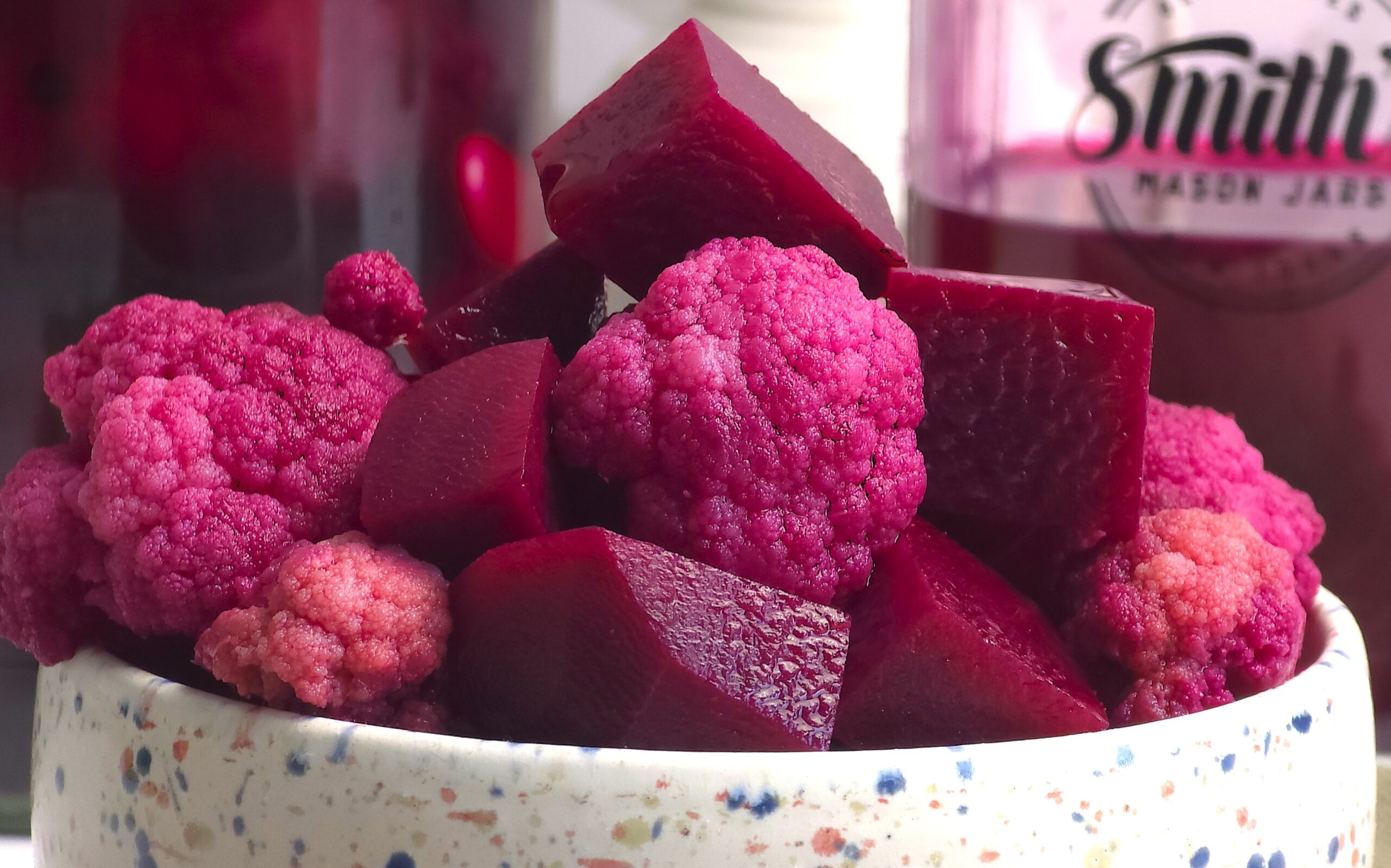 a close look of fermented beetroot and cauliflower