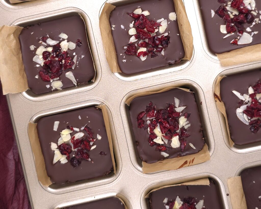 chilled almond cranberry chocolate bars in molds