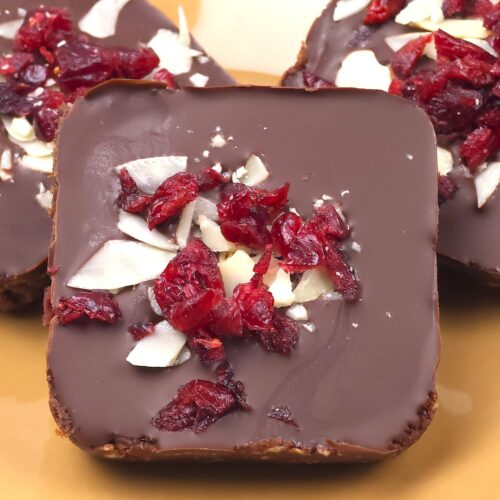 almond cranberry chocolate bars in a dessert plate