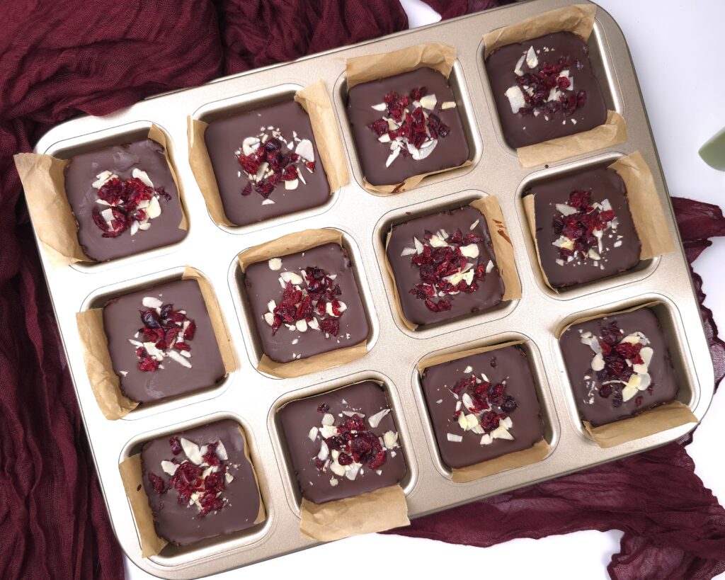chilled almond cranberry chocolate bars in molds