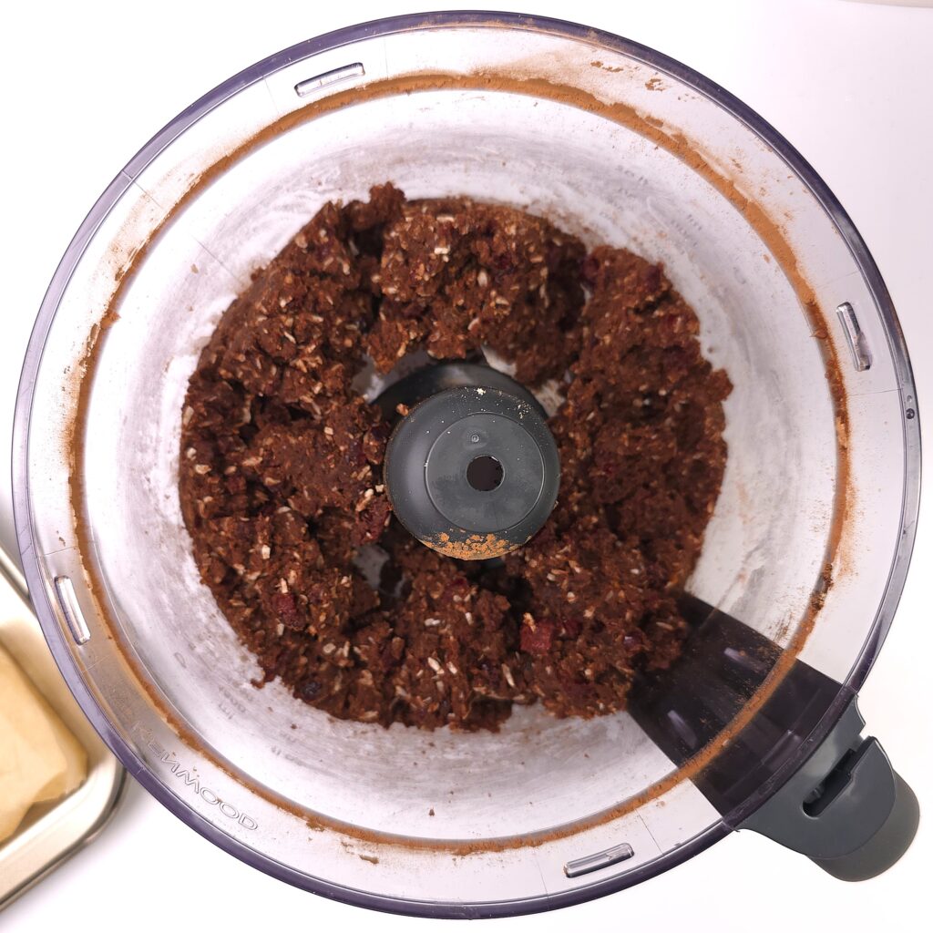 almond cranberry chocolate bars mixture in a food processor