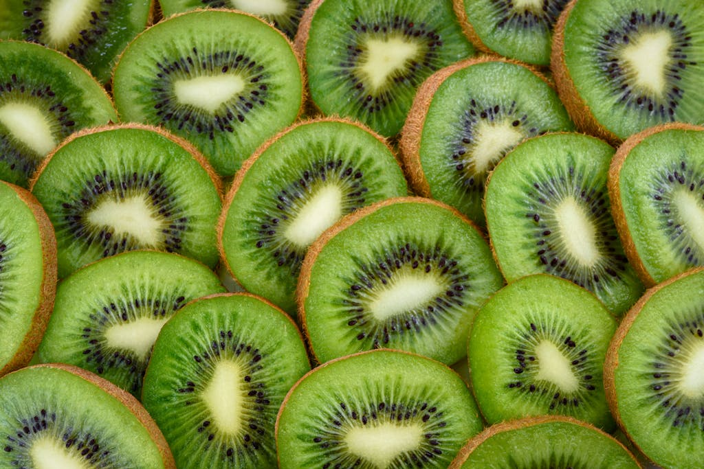 Vibrant, fresh kiwi slices arranged close-up, highlighting their juicy and nutritious appeal in terms of detox myths and facts