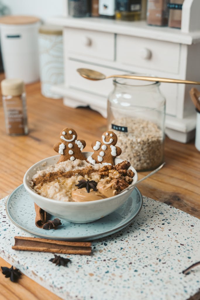 A cozy and festive oatmeal bowl topped with gingerbread cookies.