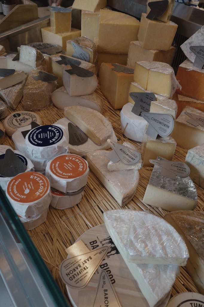 A variety of artisan cheeses displayed in a rustic setting, highlighting diverse textures and colors.
