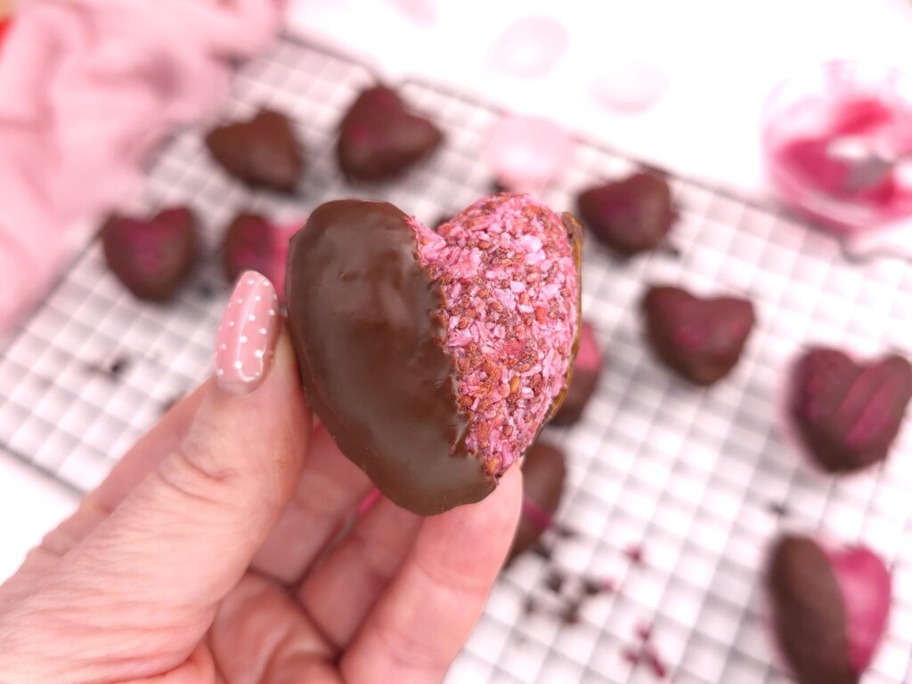 Chocolate-covered raspberry heart-shaped sweet treat