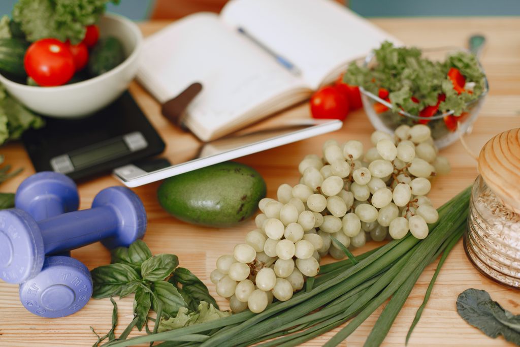 A vibrant composition of fruits, vegetables, and fitness items promoting a healthy lifestyle for metabolic health and gut health