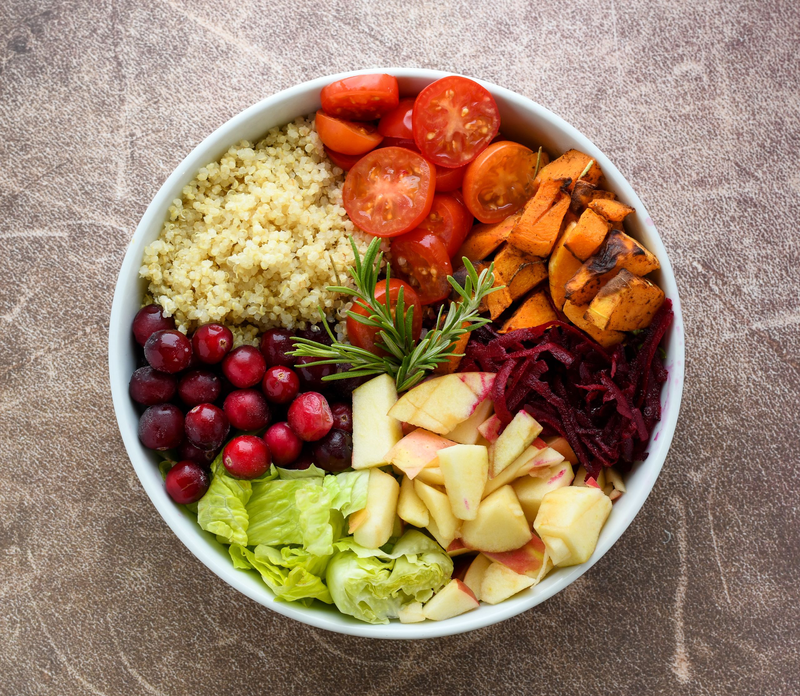 A vibrant Buddha bowl filled with quinoa, fresh fruits, and vegetables. Perfect for a healthy meal plan.